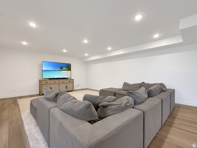 916 Rocky Mountain Way Elk Ridge, UT 84651 - Photo 39 of 54 Living room featuring light wood finished floors and recessed lighting