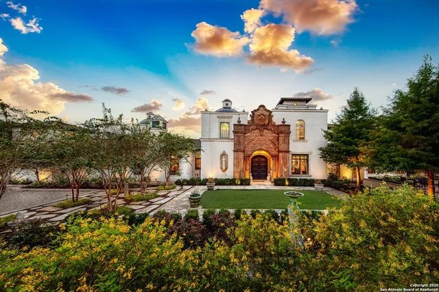 a large building with trees in the background