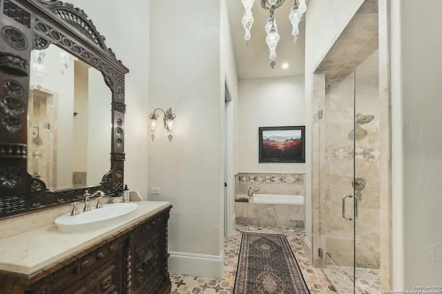 a bathroom with a sink vanity and mirror