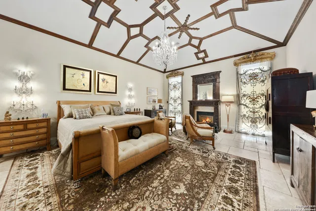 a spacious bedroom with a bed a couch and dresser