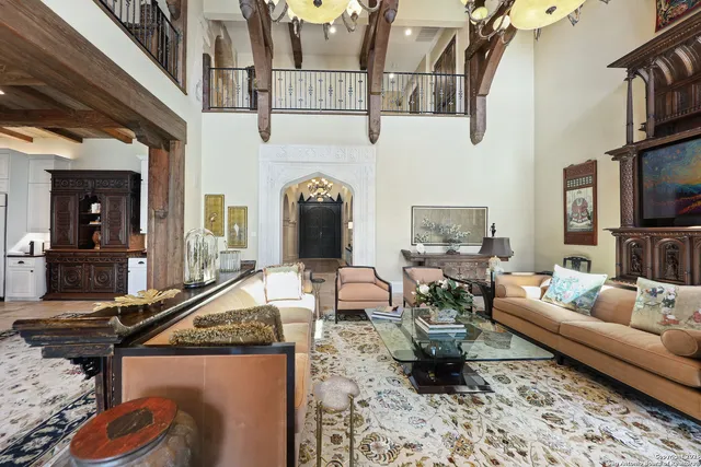 a living room with furniture fireplace and flat screen tv
