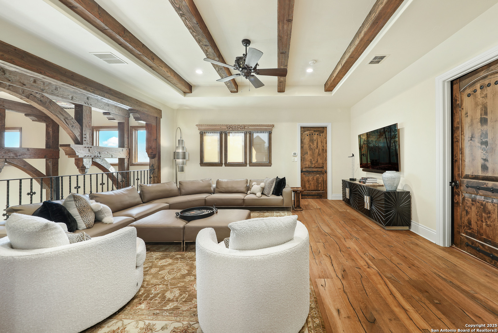 640 Terrell Road Terrell Hills, TX 78209 - Photo 23 of 34 a living room with furniture wooden floor and a flat screen tv