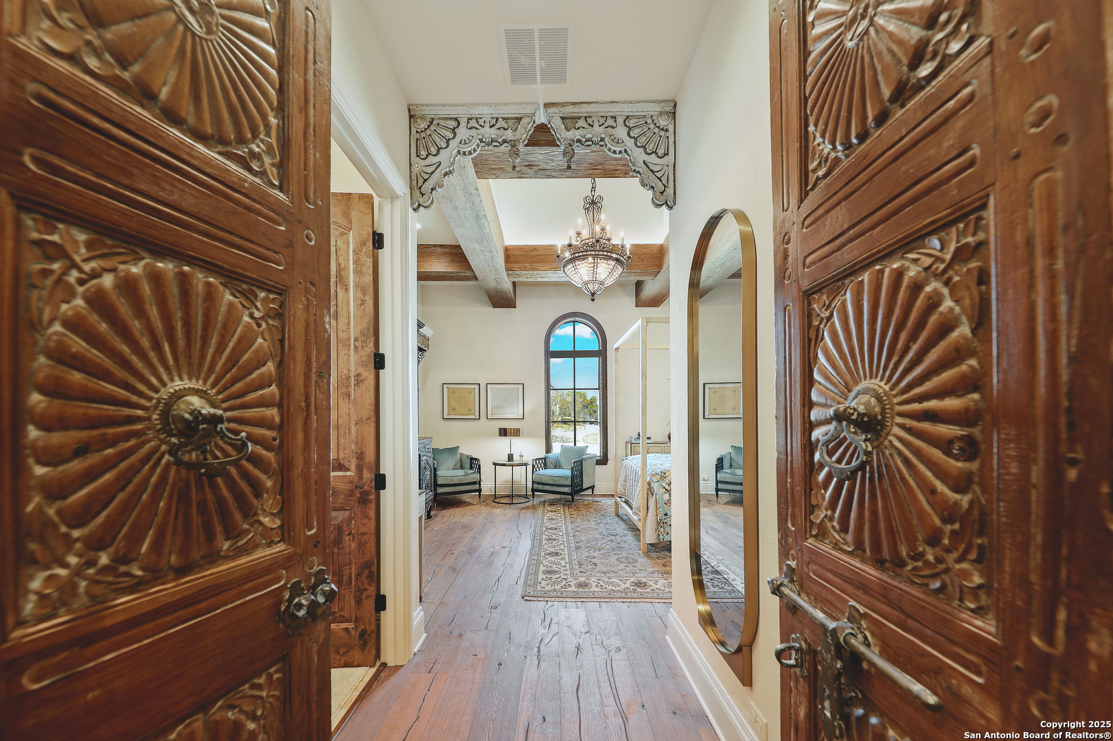 640 Terrell Road Terrell Hills, TX 78209 - Photo 25 of 34 a view of a hallway and wooden floor with a chandelier