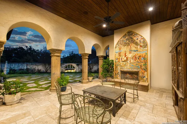 a swimming pool with outdoor seating and yard