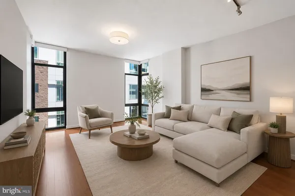 a living room with furniture or couch and a flat screen tv