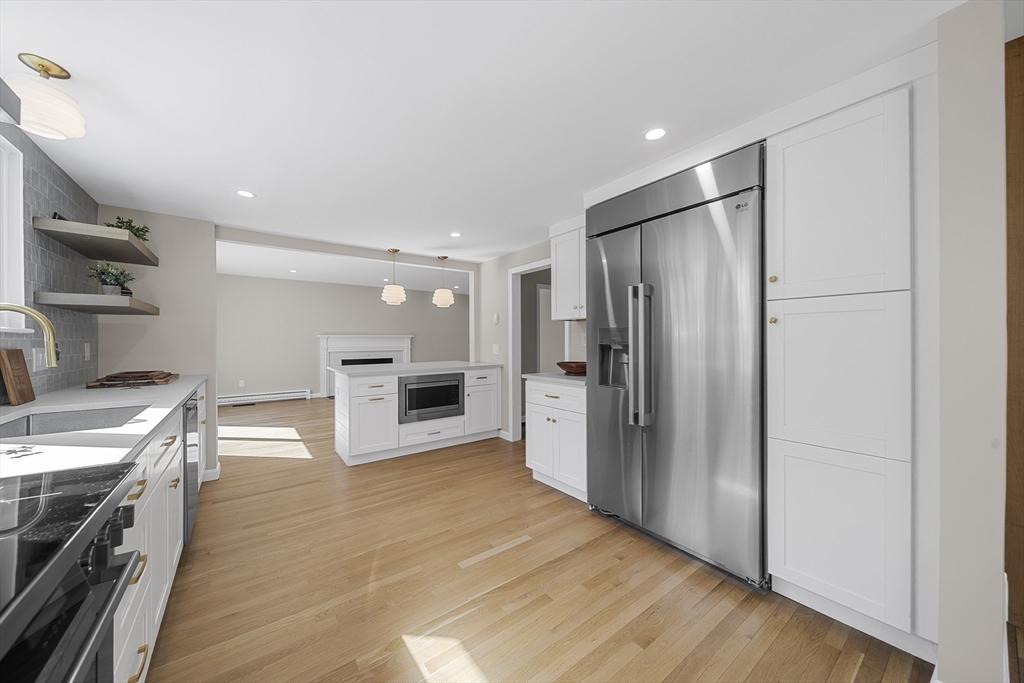 4 Fox Run Road Bedford, MA 01730 - Photo 12 of 42 a kitchen with stainless steel appliances a refrigerator and a stove top oven