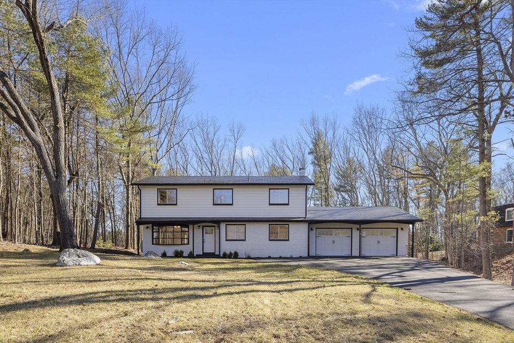 4 Fox Run Road Bedford, MA 01730 - Photo 2 of 42 a view of a building with a snow on the road