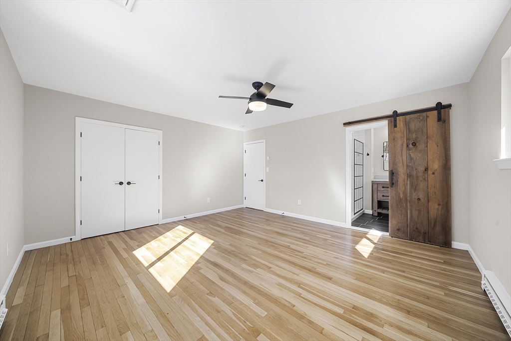 4 Fox Run Road Bedford, MA 01730 - Photo 24 of 42 a view of empty room with wooden floor and fan