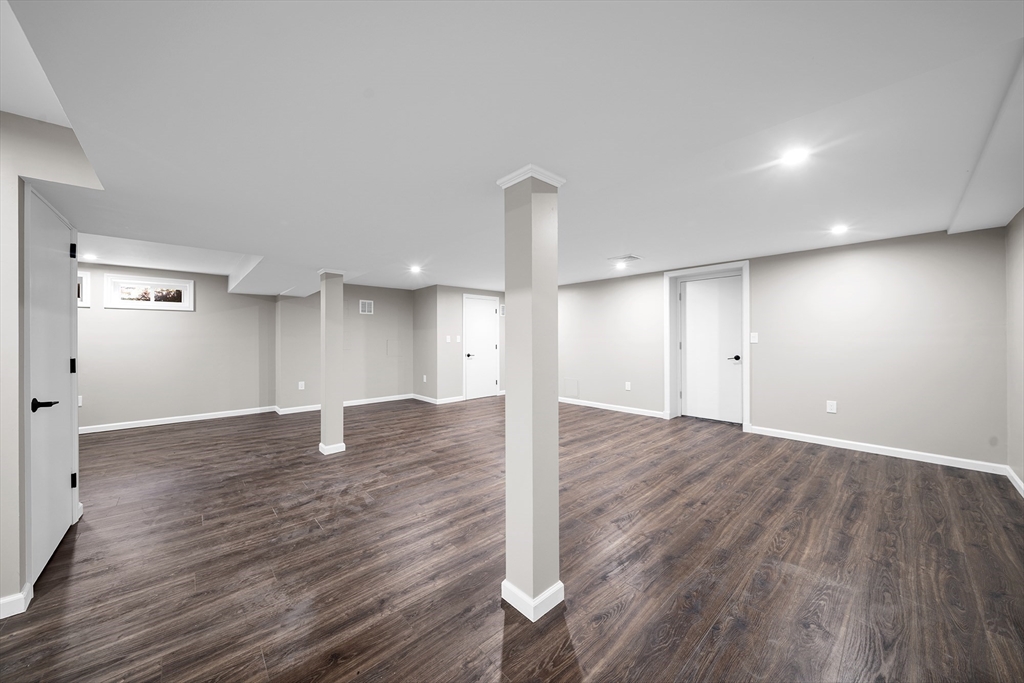 4 Fox Run Road Bedford, MA 01730 - Photo 31 of 42 a view of empty room with wooden floor