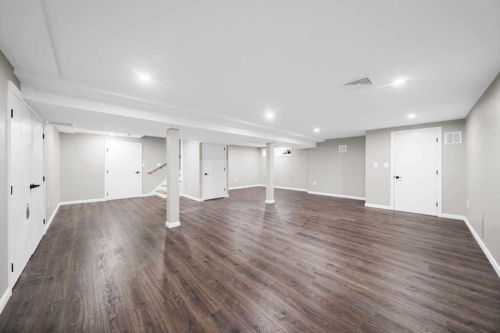 4 Fox Run Road Bedford, MA 01730 - Photo 32 of 42 a view of empty room with wooden floor