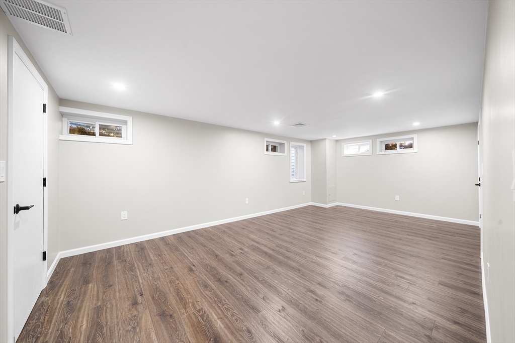 4 Fox Run Road Bedford, MA 01730 - Photo 33 of 42 a view of empty room with wooden floor