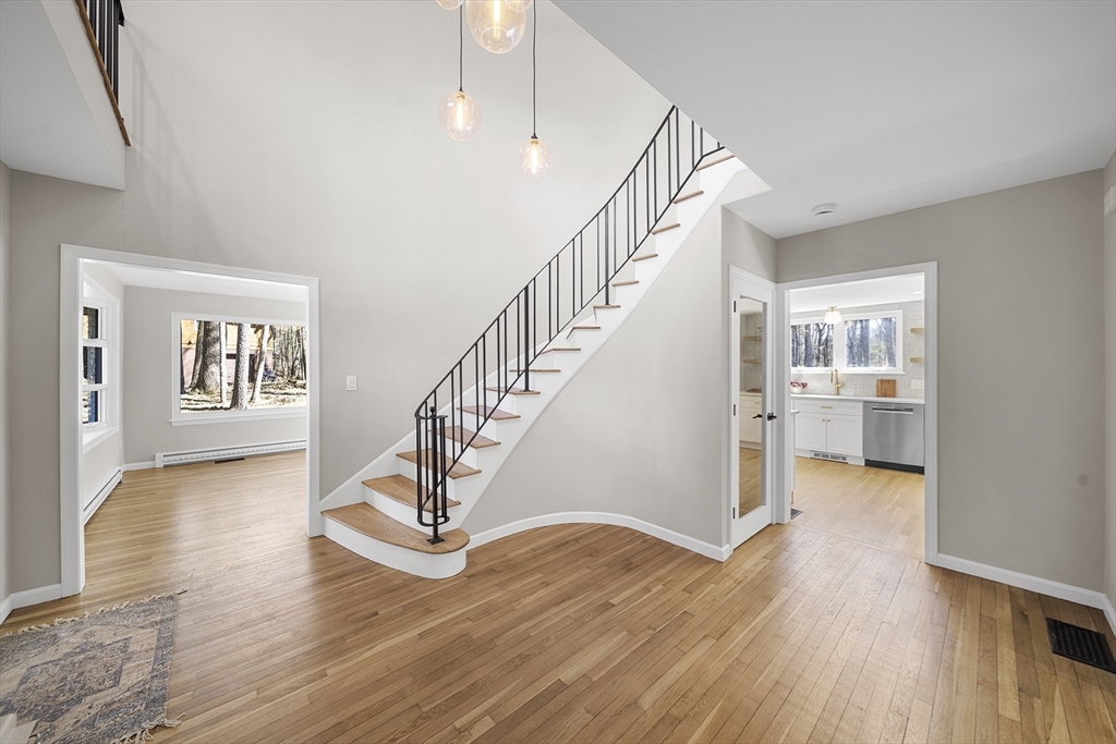 4 Fox Run Road Bedford, MA 01730 - Photo 4 of 42 a view of entryway and hall with wooden floor
