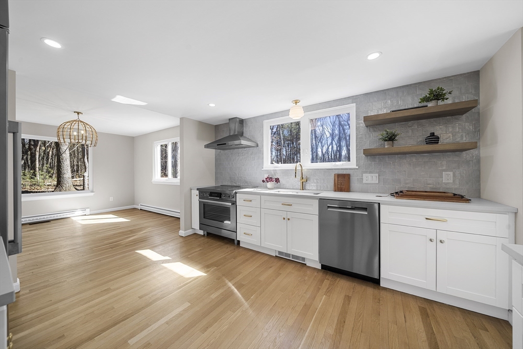 4 Fox Run Road Bedford, MA 01730 - Photo 10 of 42 a kitchen with a sink cabinets and wooden floor