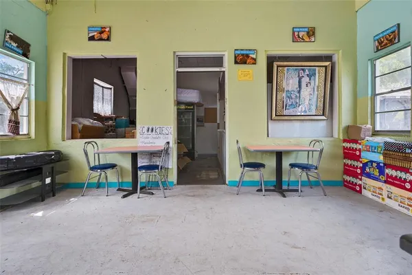 a view of hall way with furniture