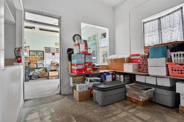 a stove top oven sitting inside of a kitchen