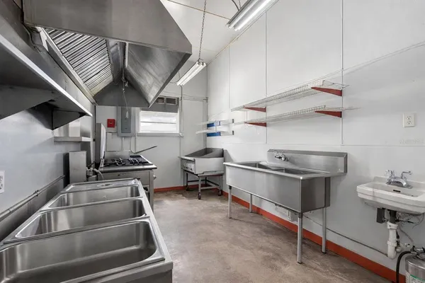 a kitchen with a stove and a sink