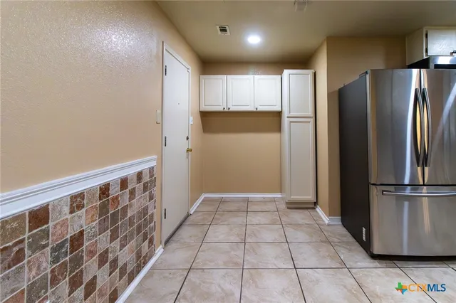 a view of a kitchen with a sink and a window