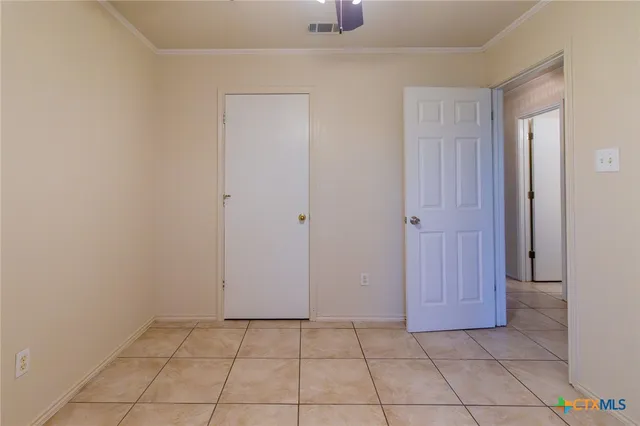 a house that has a tree in front of it