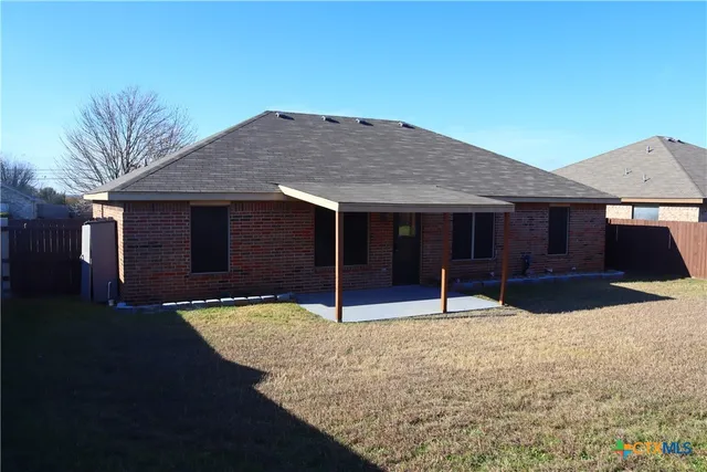a house view with a garden space