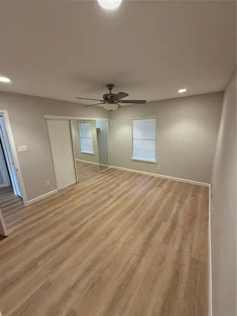 a view of an empty room and a window