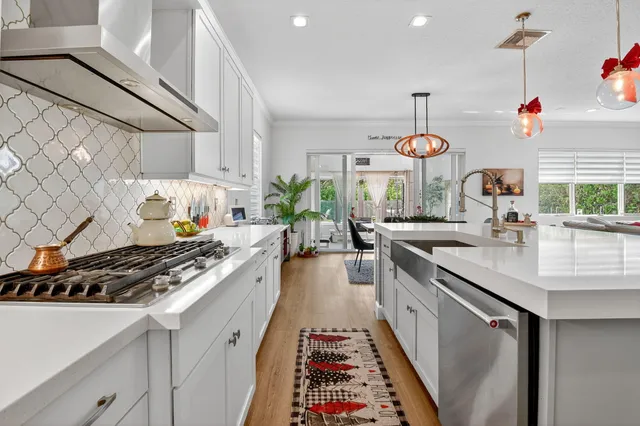 a kitchen with a table chairs and a dining table