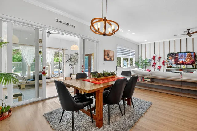 a living room with furniture gym equipment and a large window