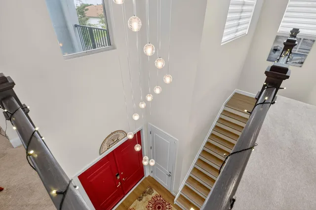 a view of a hallway with a flat screen tv