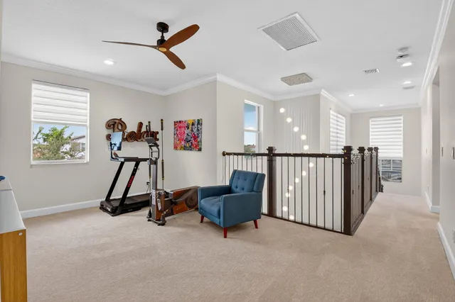 a view of a hallway with closet and workspace