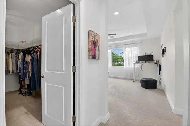 a spacious bedroom with a bed and a couch