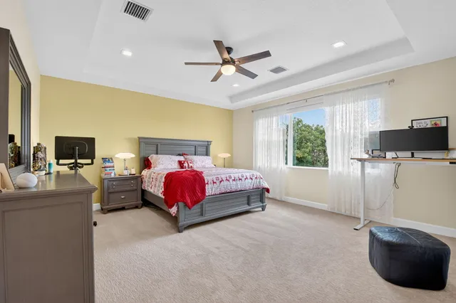 a spacious bathroom with a tub sink and shower