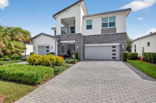 a view of hallway with wooden floor