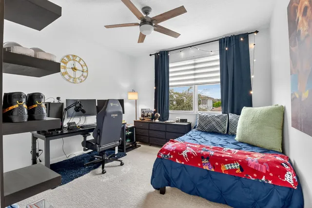 a bathroom with double vanity sinks and a mirror