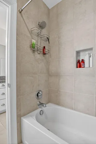 a bedroom with furniture and a chandelier