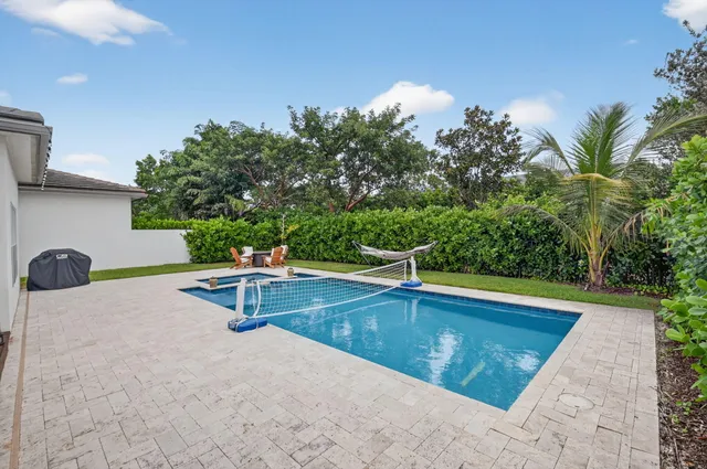 an aerial view of multiple houses with yard