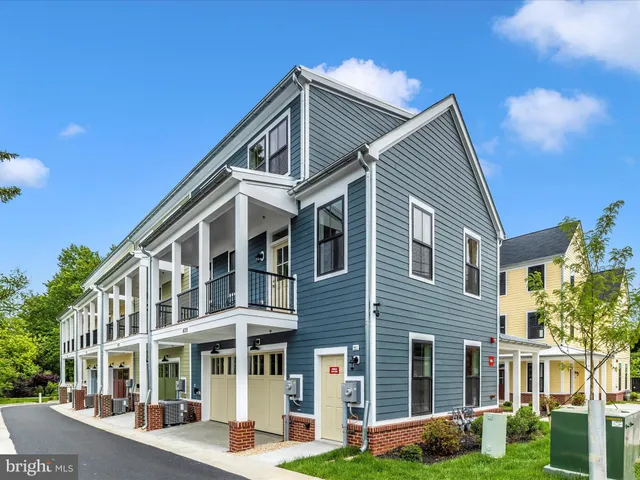 a front view of a building with garden