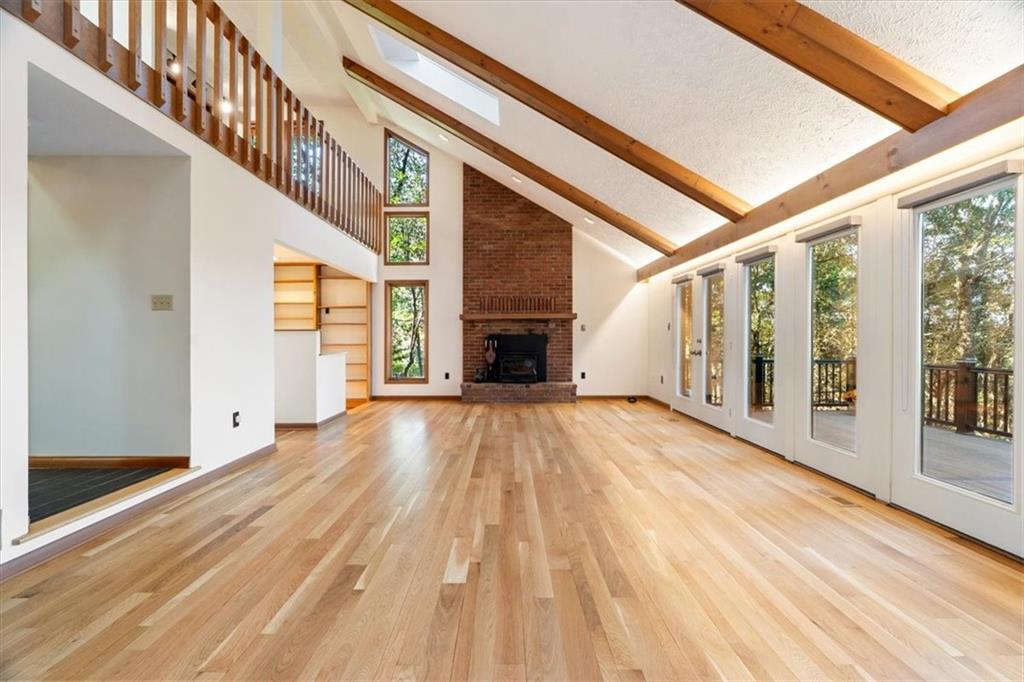 3 Partridge Court Sewickley, PA 15143 - Photo 11 of 50 a view of an empty room with wooden floor and a window
