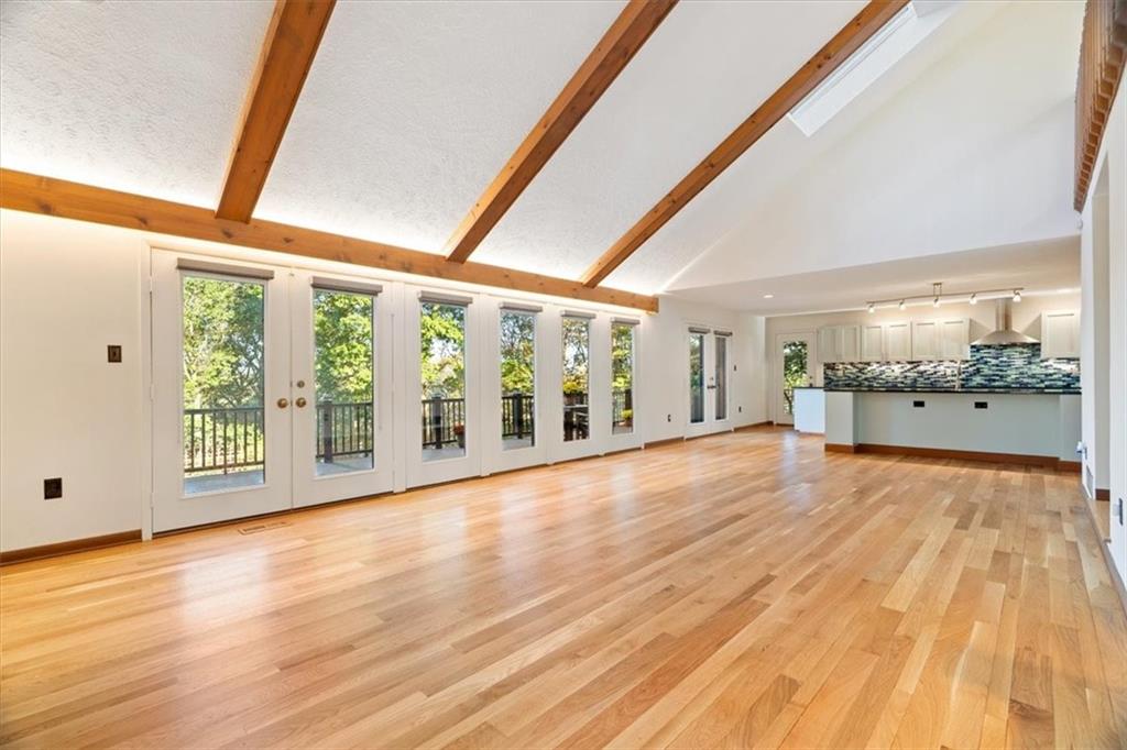 3 Partridge Court Sewickley, PA 15143 - Photo 12 of 50 a view of an empty room with wooden floor and a window