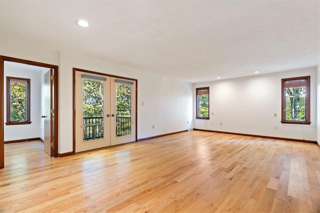 3 Partridge Court Sewickley, PA 15143 - Photo 21 of 50 a view of an empty room with window and wooden floor