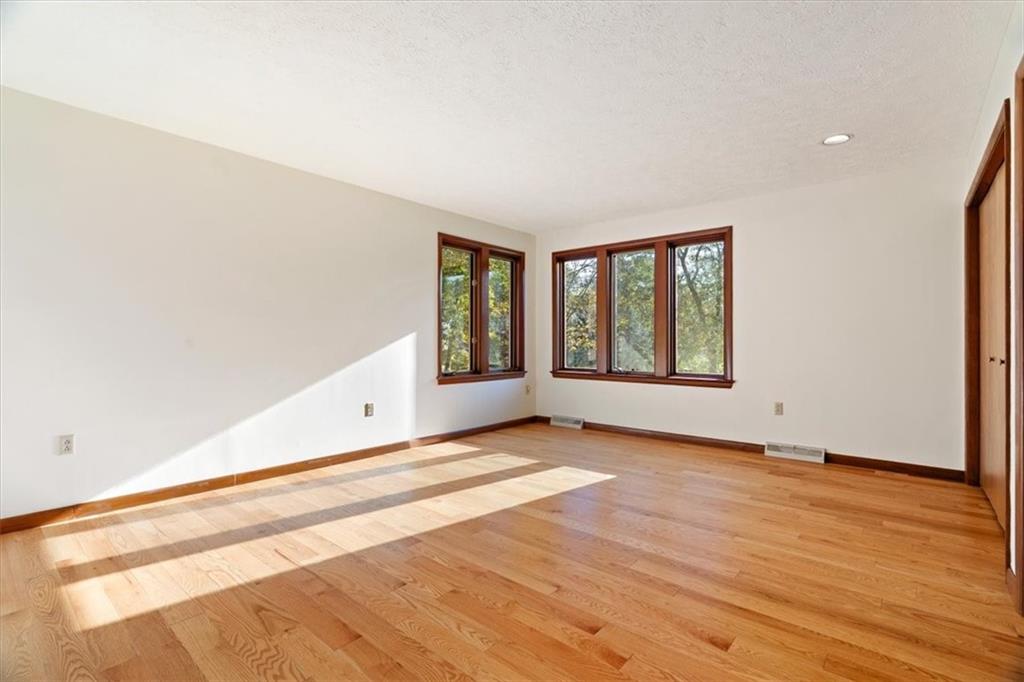 3 Partridge Court Sewickley, PA 15143 - Photo 30 of 50 a view of an empty room with wooden floor and a window