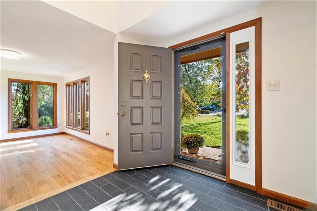 3 Partridge Court Sewickley, PA 15143 - Photo 3 of 50 a view of an empty room with wooden floor and windows