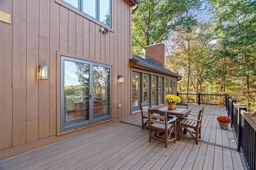 3 Partridge Court Sewickley, PA 15143 - Photo 40 of 50 a view of a two chairs and table in the balcony with wooden floor