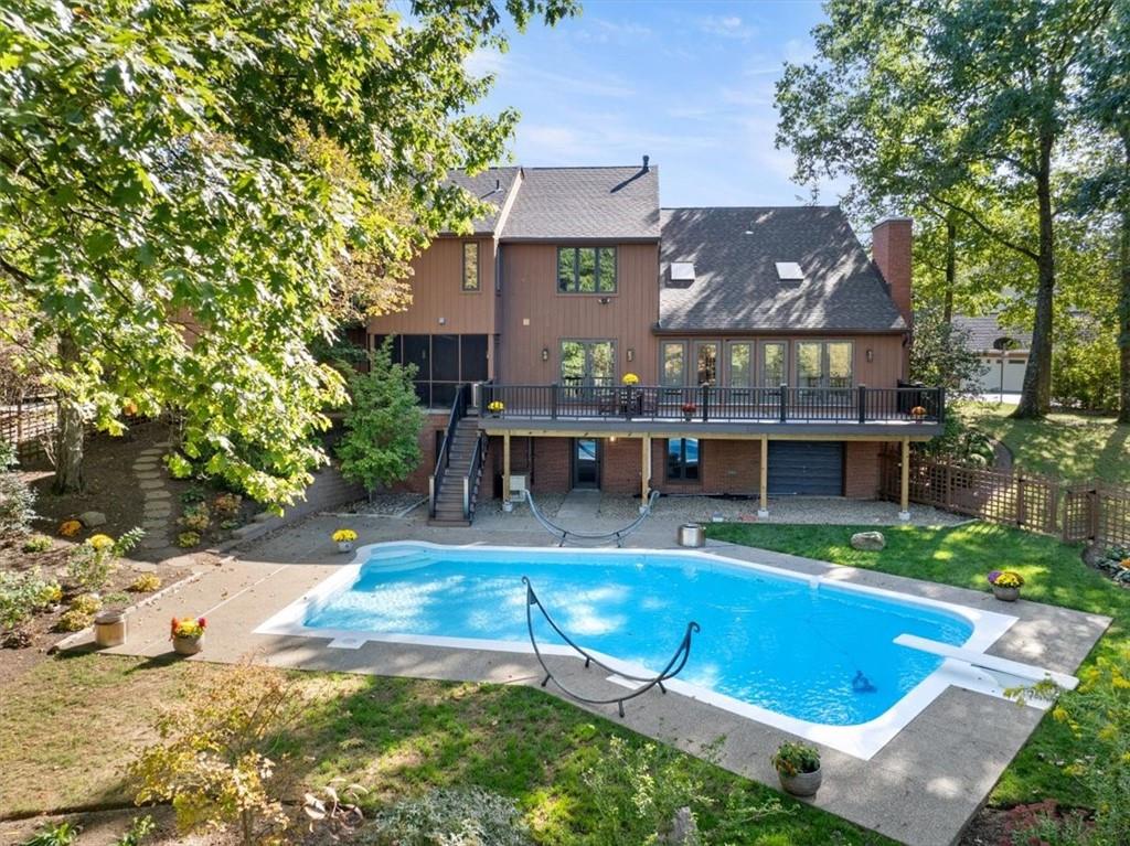 3 Partridge Court Sewickley, PA 15143 - Photo 45 of 50 a view of house with yard outdoor seating and swimming pool