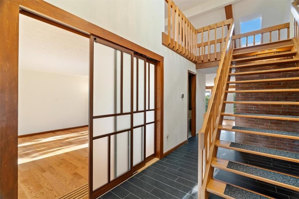 3 Partridge Court Sewickley, PA 15143 - Photo 5 of 50 a view of staircase with wooden floor and a window