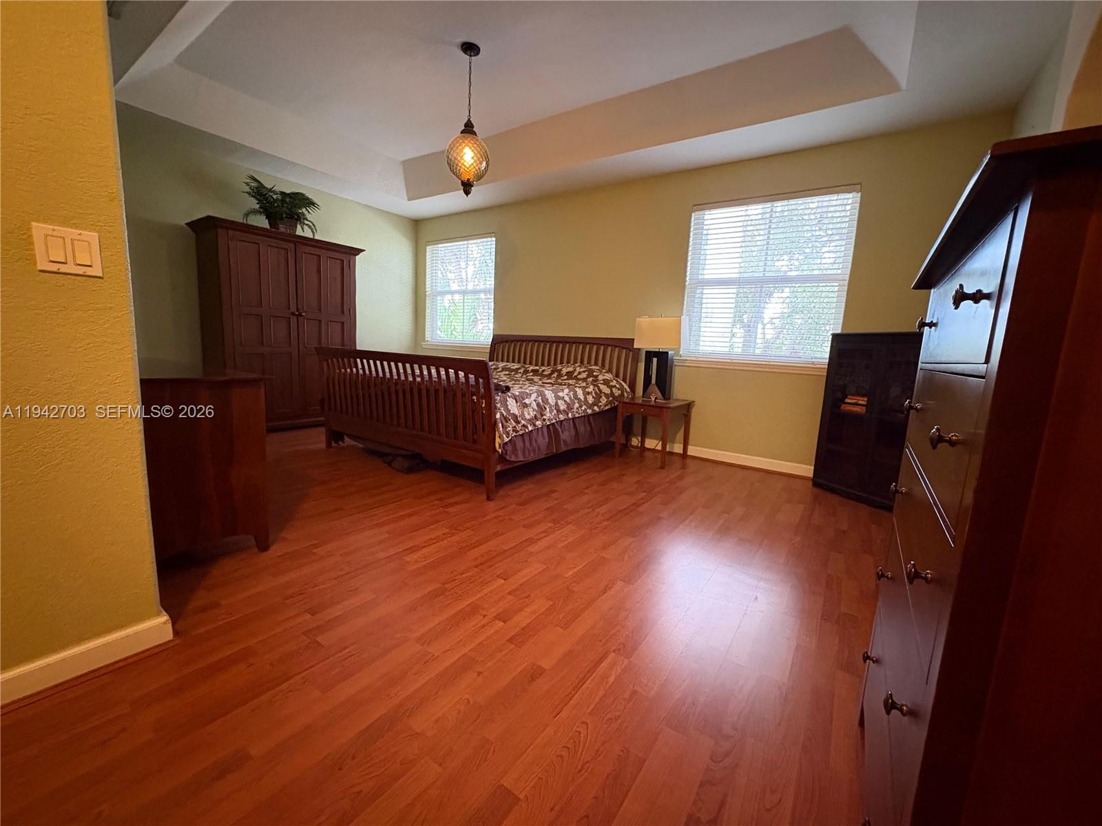 5902 Southwest 166th Court Miami, FL 33193 - Photo 13 of 27 a bedroom with furniture and window