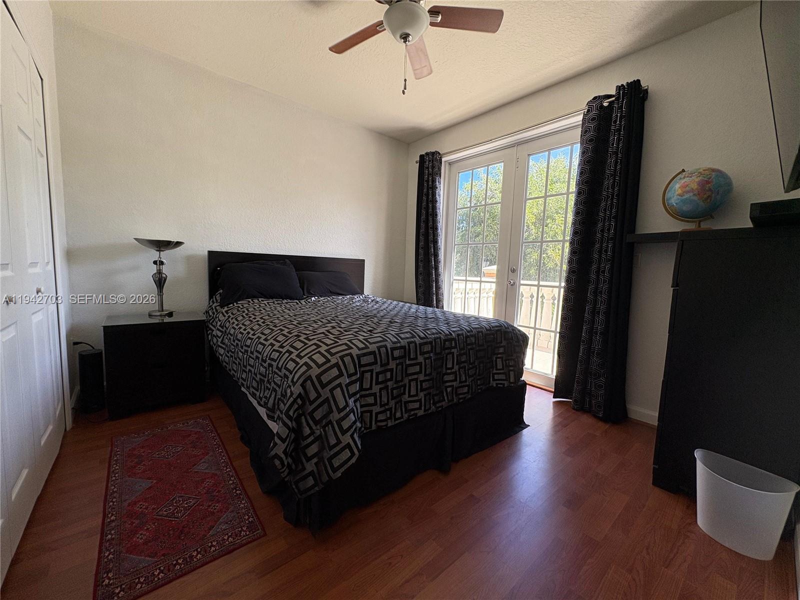 5902 Southwest 166th Court Miami, FL 33193 - Photo 17 of 27 a bedroom with a bed and window