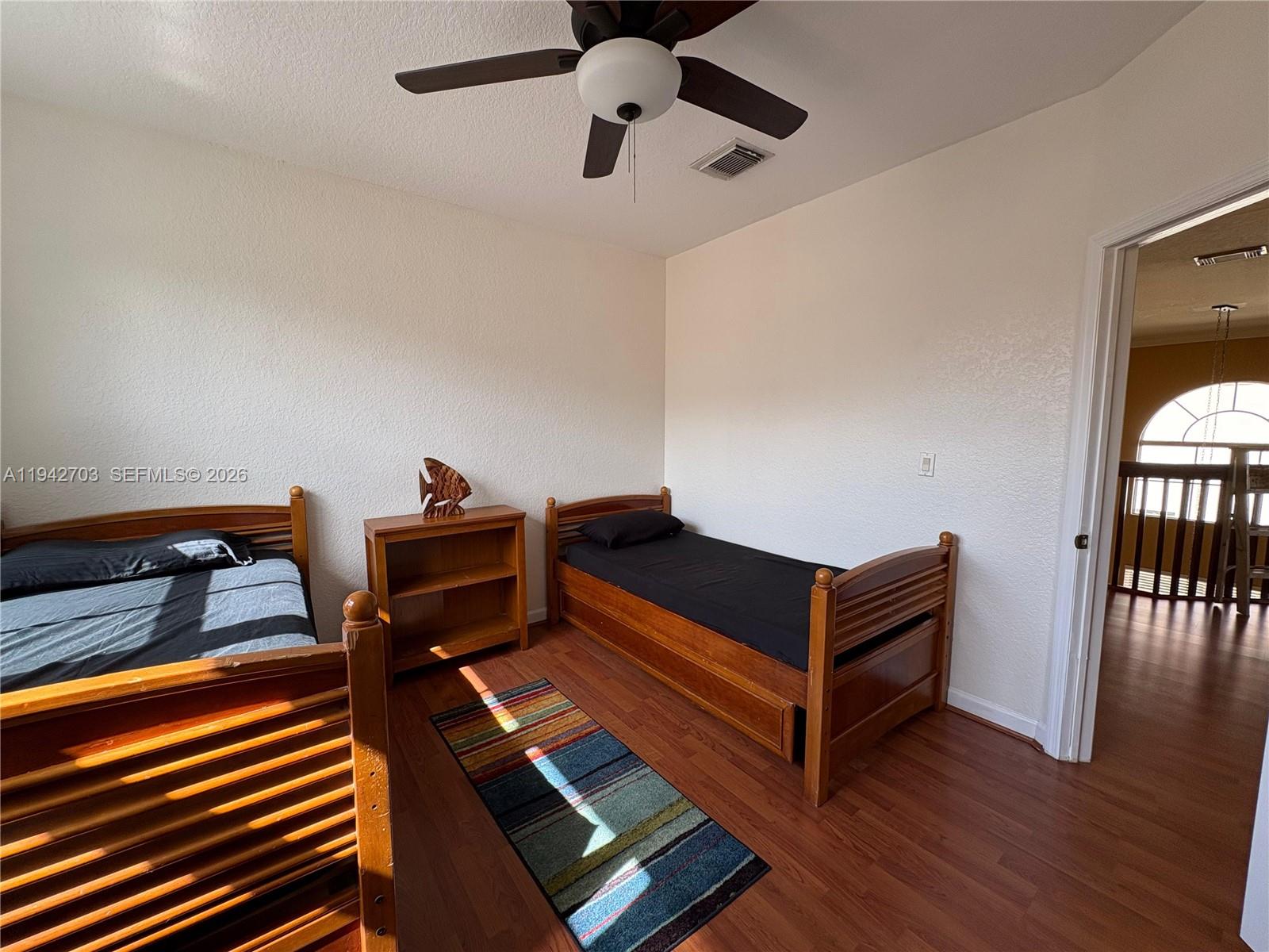5902 Southwest 166th Court Miami, FL 33193 - Photo 22 of 27 a living room with furniture and a window