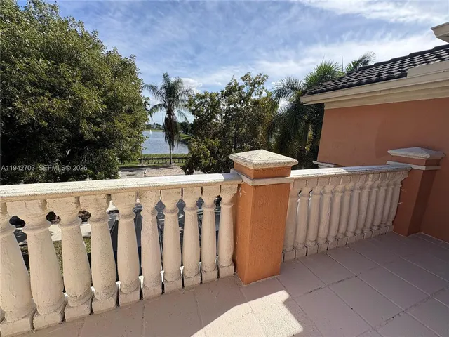 a view of a sink and yard with wooden fence