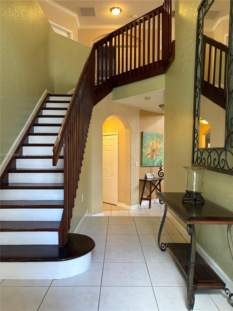 5902 Southwest 166th Court Miami, FL 33193 - Photo 3 of 27 a view of entryway and hall with wooden floor