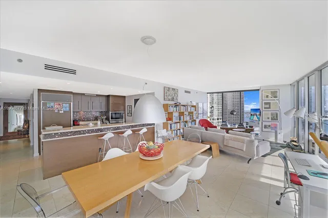 a kitchen with stainless steel appliances a stove and a microwave
