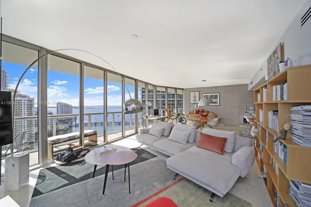a living room with furniture and a rug